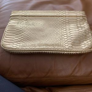 Gold Guess clutch.